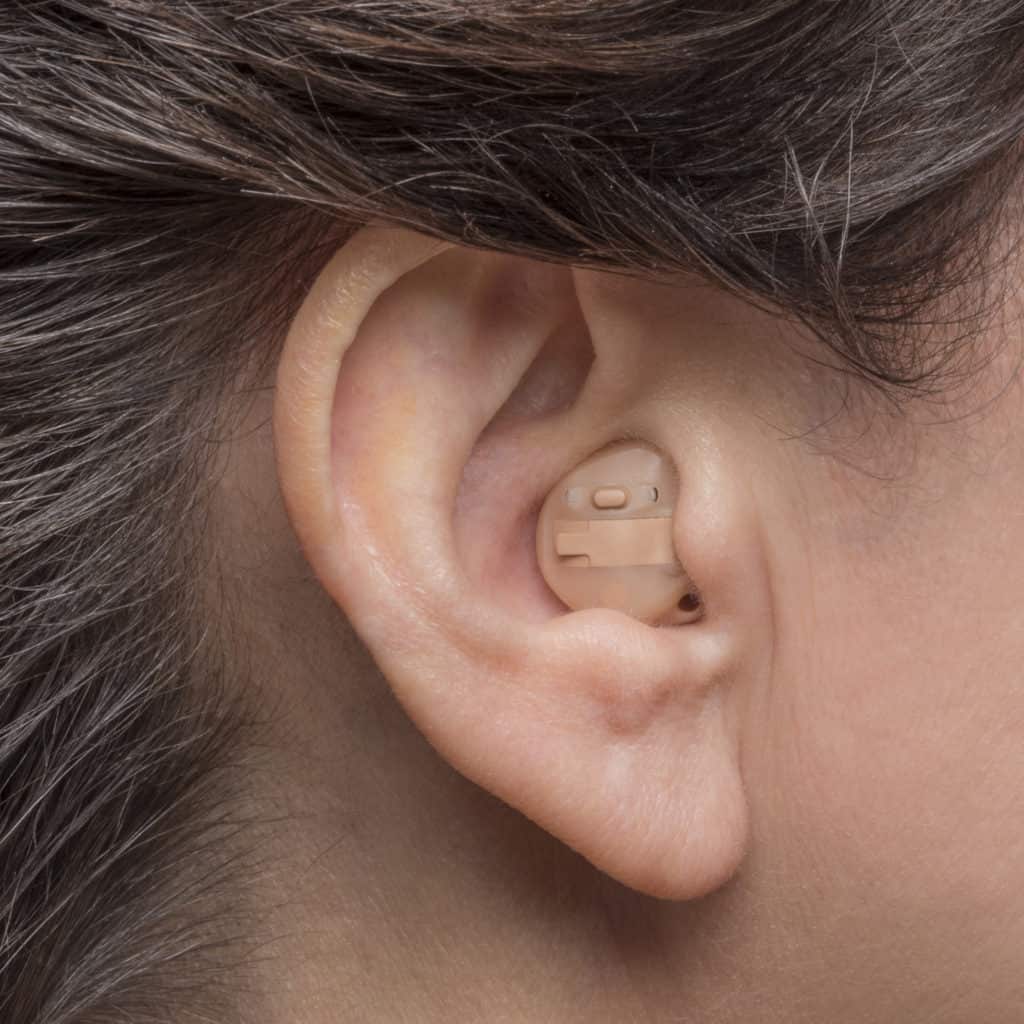 how do you put hearing aids in