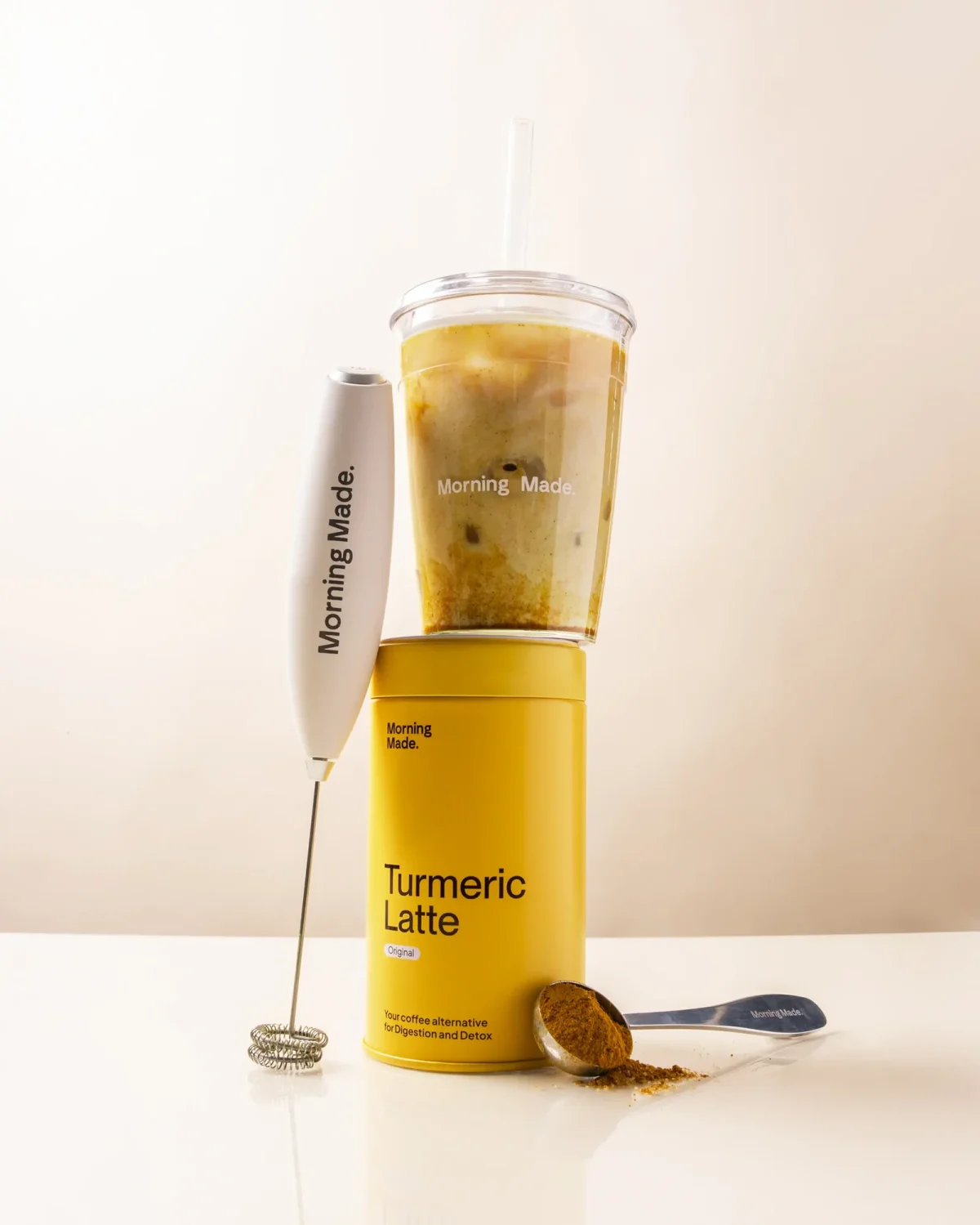 A mug of warm turmeric drink on a kitchen counter in the morning